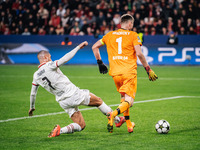 Alvaro Morata of AC Milan and Lukas Hradecky of Bayer 04 Leverkusen are in action during the UEFA Champions League 2024/25 League Phase MD2...