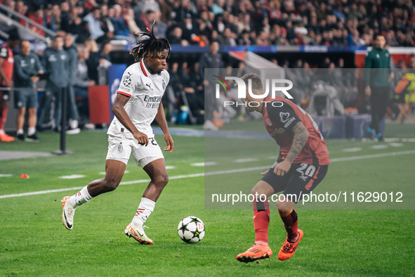 Samuel Chukwueze of AC Milan and Alejandro Grimaldo of Bayer 04 Leverkusen are in action during the UEFA Champions League 2024/25 League Pha...