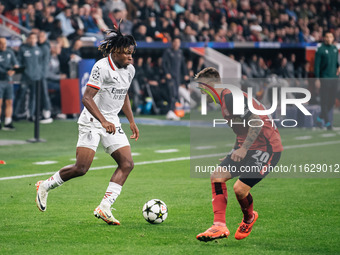 Samuel Chukwueze of AC Milan and Alejandro Grimaldo of Bayer 04 Leverkusen are in action during the UEFA Champions League 2024/25 League Pha...