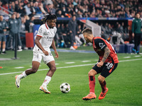 Samuel Chukwueze of AC Milan and Alejandro Grimaldo of Bayer 04 Leverkusen are in action during the UEFA Champions League 2024/25 League Pha...