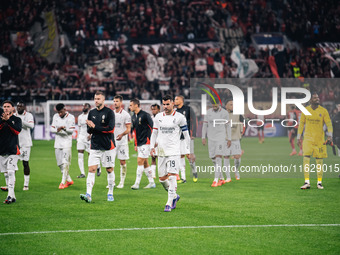 Players of AC Milan greet fans after the UEFA Champions League 2024/25 League Phase MD2 match between Bayer 04 Leverkusen and AC Milan at Ba...