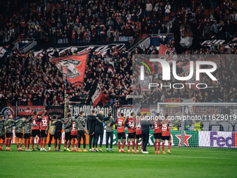 Players of Bayer 04 Leverkusen celebrate with fans after the UEFA Champions League 2024/25 League Phase MD2 match between Bayer 04 Leverkuse...