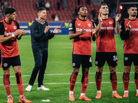 Xabi Alonso, Head Coach of Bayer 04 Leverkusen, and his players celebrate with fans after the UEFA Champions League 2024/25 League Phase MD2...