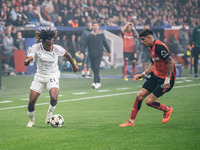 Samuel Chukwueze of AC Milan and Piero Hincapie of Bayer 04 Leverkusen are in action during the UEFA Champions League 2024/25 League Phase M...