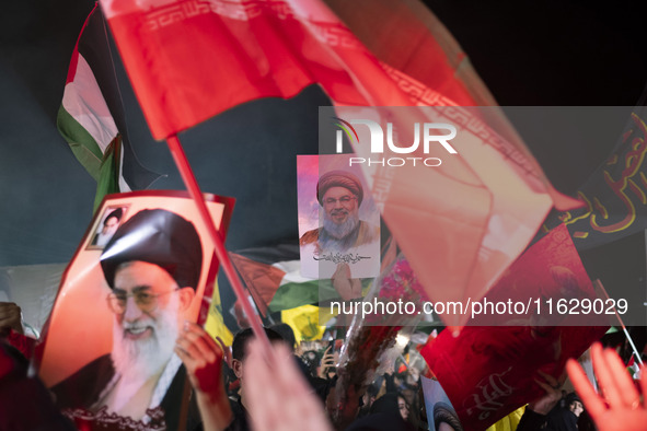 Iranians hold portraits of Lebanon's Hezbollah Secretary General, Hassan Nasrallah, who was killed in an Israeli air strike in the suburb of...