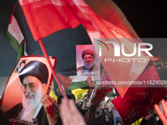 Iranians hold portraits of Lebanon's Hezbollah Secretary General, Hassan Nasrallah, who was killed in an Israeli air strike in the suburb of...