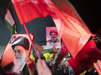 Iranians hold portraits of Lebanon's Hezbollah Secretary General, Hassan Nasrallah, who was killed in an Israeli air strike in the suburb of...