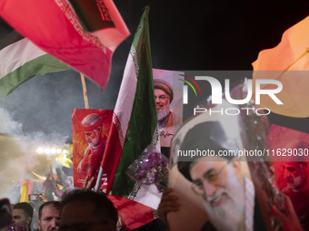 Iranians hold portraits of Lebanon's Hezbollah Secretary General, Hassan Nasrallah, who was killed in an Israeli air strike in the suburb of...