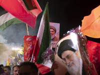 Iranians hold portraits of Lebanon's Hezbollah Secretary General, Hassan Nasrallah, who was killed in an Israeli air strike in the suburb of...