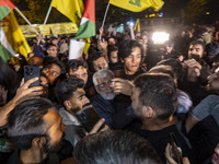 Saeed Jalili, Iranian politician and diplomat, opens his way through the people celebrating Iran's missile attack against Israel, in Tehran,...