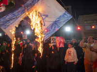 Iranian protesters burn an Israeli flag during a celebration for Iran's missile attack against Israel, in Tehran, Iran, on October 1, 2024....