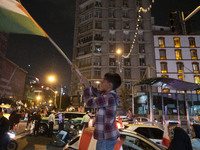 A young Iranian boy waves a Palestinian flag while celebrating Iran's missile attack against Israel in Tehran, Iran, on October 1, 2024. Ira...