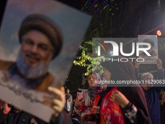 Iranians hold portraits of Lebanon's Hezbollah Secretary General, Hassan Nasrallah, who was killed in an Israeli air strike in the suburbs o...