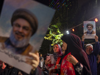 Iranians hold portraits of Lebanon's Hezbollah Secretary General, Hassan Nasrallah, who was killed in an Israeli air strike in the suburbs o...