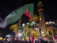 Iranians wave flags while celebrating Iran's missile attack against Israel in Tehran, Iran, on October 1, 2024. Iran launches hundreds of ba...