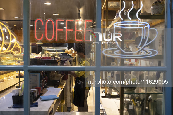 A young Iranian barista works at a cafe in downtown Tehran, Iran, on October 1, 2024, after Iran's missile attack against Israel. Iran launc...