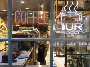 A young Iranian barista works at a cafe in downtown Tehran, Iran, on October 1, 2024, after Iran's missile attack against Israel. Iran launc...