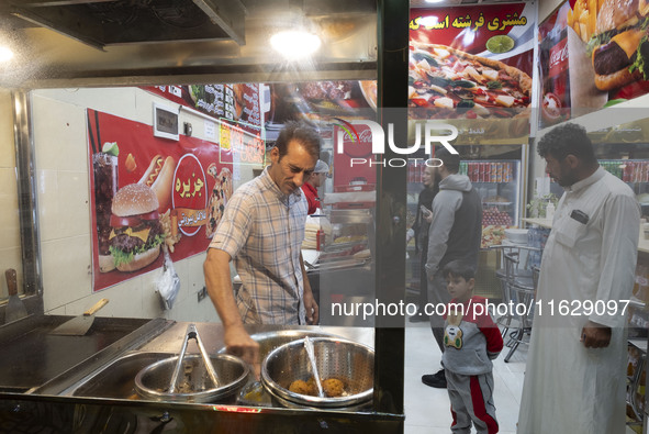 A view of a small fast-food restaurant in downtown Tehran, Iran, on October 1, 2024, after Iran's missile attack against Israel. Iran launch...