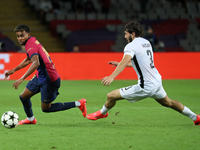 Lamine Yamal and Jaouen Hadjam play during the match between FC Barcelona and BSC Young Boys in the week 2 of the League Stage of the UEFA C...