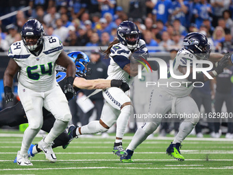 DETROIT,MICHIGAN-September 30: Seattle Seahawks wide receiver Laviska Shenault Jr. (1) runs the ball against Detroit Lions defensive end Aid...