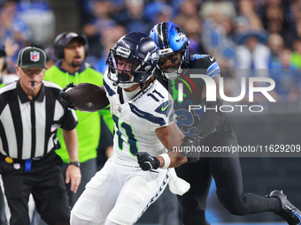 DETROIT,MICHIGAN-September 30: Seattle Seahawks wide receiver Jaxon Smith-Njigba (11) runs the ball against Detroit Lions cornerback Amik Ro...