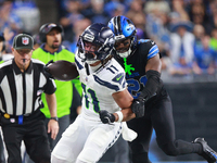 DETROIT,MICHIGAN-September 30: Seattle Seahawks wide receiver Jaxon Smith-Njigba (11) runs the ball against Detroit Lions cornerback Amik Ro...