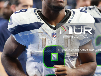 DETROIT,MICHIGAN-September 30: Seattle Seahawks running back Kenneth Walker III (9) walks off the field after the conclusion of an NFL footb...