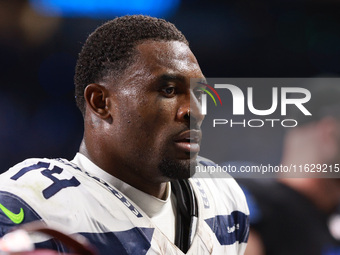 DETROIT,MICHIGAN-September 30: Seattle Seahawks wide receiver DK Metcalf (14) walks off the field after the conclusion of an NFL football ga...