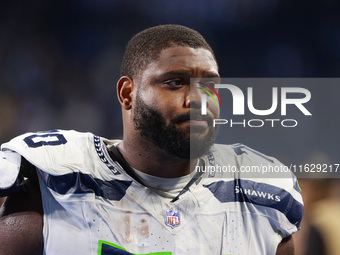 DETROIT,MICHIGAN-September 30: Seattle Seahawks guard Laken Tomlinson (70) walks off the field after the conclusion of an NFL football game...