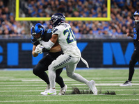 DETROIT,MICHIGAN-September 30: Detroit Lions tight end Brock Wright (89) is tackled by Seattle Seahawks safety Julian Love (20) during the f...