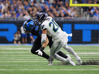 DETROIT,MICHIGAN-September 30: Detroit Lions tight end Brock Wright (89) is tackled by Seattle Seahawks safety Julian Love (20) during the f...