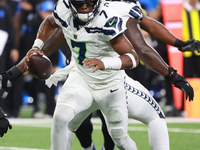 DETROIT,MICHIGAN-September 30: Seattle Seahawks quarterback Geno Smith (7) runs the ball during the first half of an NFL football game betwe...