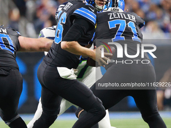 DETROIT,MICHIGAN-September 30: Detroit Lions quarterback Jared Goff (16) looks to pass during the first half of an NFL football game between...