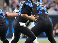 DETROIT,MICHIGAN-September 30: Detroit Lions quarterback Jared Goff (16) looks to pass during the first half of an NFL football game between...