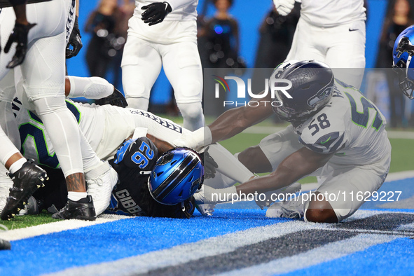 DETROIT,MICHIGAN-September 30: Detroit Lions running back Jahmyr Gibbs (26) scores a touchdown during the first half of an NFL football game...