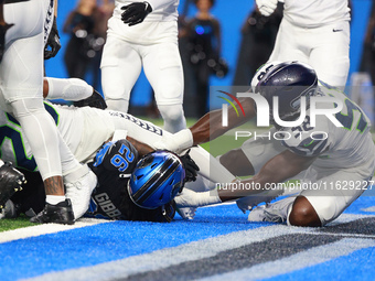 DETROIT,MICHIGAN-September 30: Detroit Lions running back Jahmyr Gibbs (26) scores a touchdown during the first half of an NFL football game...