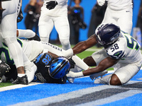 DETROIT,MICHIGAN-September 30: Detroit Lions running back Jahmyr Gibbs (26) scores a touchdown during the first half of an NFL football game...