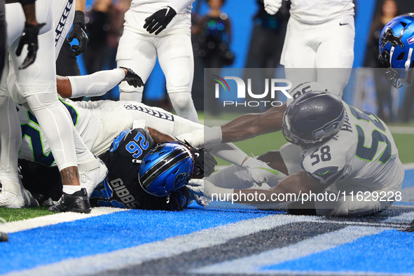 DETROIT,MICHIGAN-September 30: Detroit Lions running back Jahmyr Gibbs (26) scores a touchdown during the first half of an NFL football game...