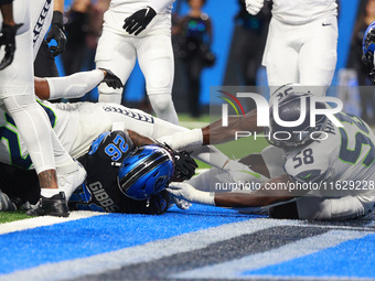 DETROIT,MICHIGAN-September 30: Detroit Lions running back Jahmyr Gibbs (26) scores a touchdown during the first half of an NFL football game...