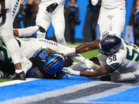 DETROIT,MICHIGAN-September 30: Detroit Lions running back Jahmyr Gibbs (26) scores a touchdown during the first half of an NFL football game...