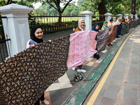 Several students and Bogor residents spread a 4-kilometer-long batik cloth along the pedestrian path, on October 2, 2024. UNESCO designated...