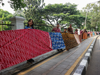 Several students and Bogor residents spread a 4-kilometer-long batik cloth along the pedestrian path, on October 2, 2024. UNESCO designated...