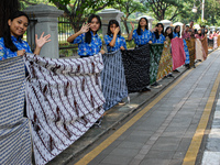 Several students and Bogor residents spread a 4-kilometer-long batik cloth along the pedestrian path, on October 2, 2024. UNESCO designated...