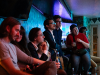 People attend a watch party at Madhatter for the vice presidential debate between Demcocrat Gov. Tim Walz (D-MN) and Republican Sen. J.D. Va...