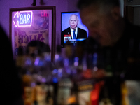 A bartender mixes drinks as the vice presidential debate plays on a television behind him in Washington, DC, on October 1, 2024.  Madhatter...