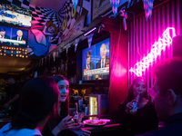 People attend a watch party at Madhatter for the Vice presidential debate between Demcocrat Gov. Tim Walz (D-MN) and Republican Sen. J.D. Va...