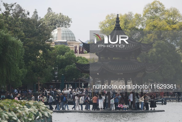 A large number of tourists visit the West Lake in Hangzhou, China, on October 2, 2024. 