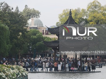 A large number of tourists visit the West Lake in Hangzhou, China, on October 2, 2024. (