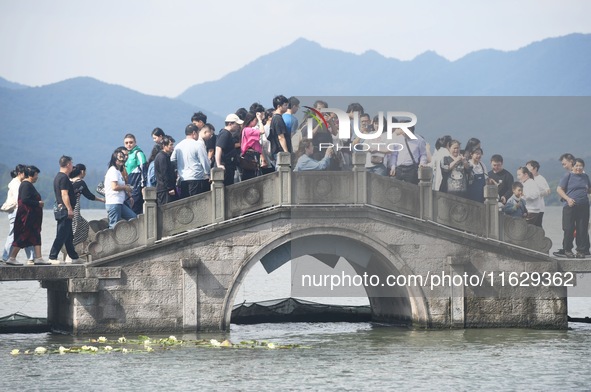 A large number of tourists visit the West Lake in Hangzhou, China, on October 2, 2024. 