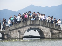 A large number of tourists visit the West Lake in Hangzhou, China, on October 2, 2024. (